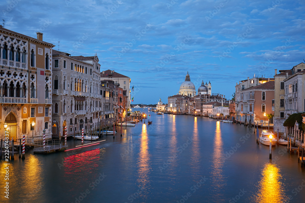 Grand Canal in Venice illuminated in the evening with Saint Mary of Health basilica view in Italy