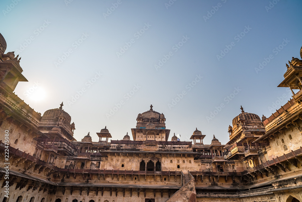 Fototapeta premium Orchha Palace, interior with courtyard and stone carvings, backlight. Also spelled Orcha, famous travel destination in Madhya Pradesh, India.