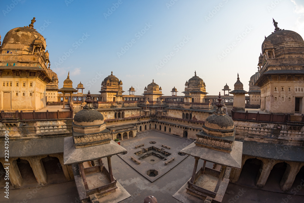 Orchha Palace, interior with courtyard and stone carvings, backlight. Also spelled Orcha, famous travel destination in Madhya Pradesh, India.