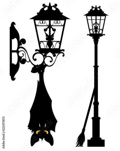 spooky bat hanging on streetlight - halloween city life vector silhouette decor set