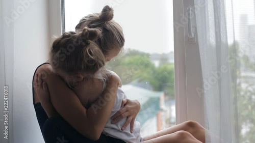 Mother and daughter hugging