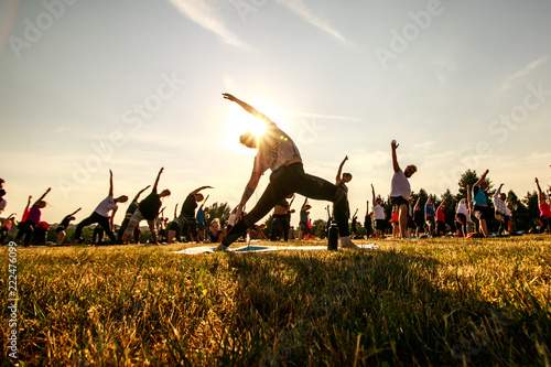 Massive yoga practice in nature photo