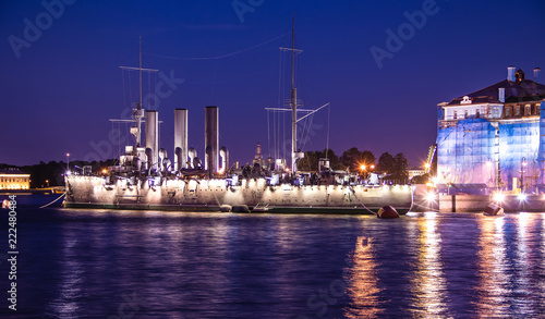 Ship Aurora in St. Petersburg, Russia, at night in June. The Neva River in St. Petersburg. Night city.