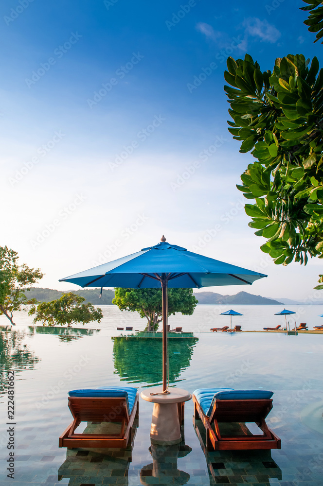 Vacation Relaxation resort beach bed in infinity pool tropical sea view, Phuket Thailand