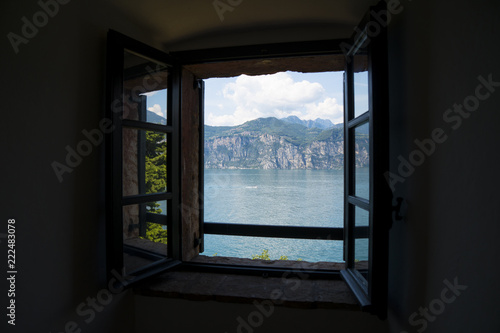 Window on Lake Garda  Italy   a holiday area appreciated by many European tourists. Lake panorama seen through a window.