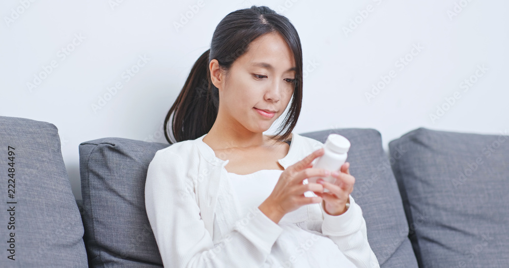 Woman check the ingredient of the medicine Woman check the ingredient of the medicine