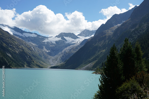 High situated reservoir in Austria with mountains in the background
 photo