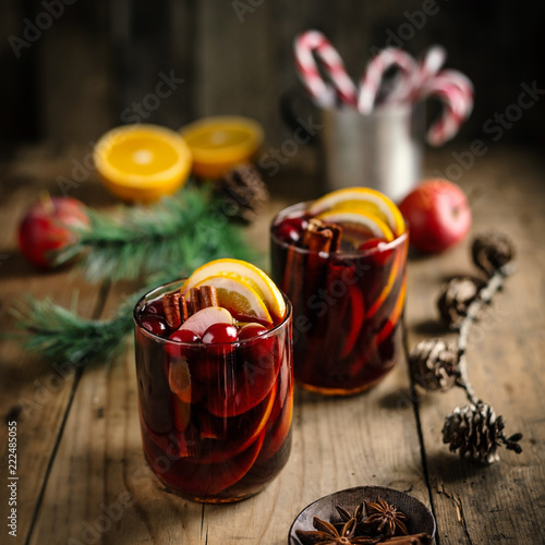 Mulled wine in glass on old rustic table