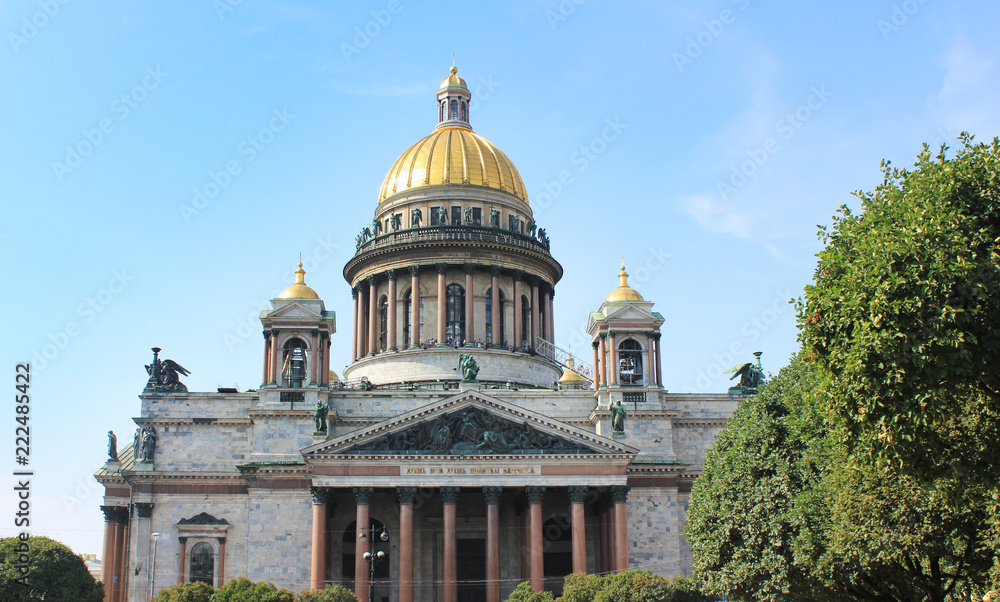 St. Isaac's Cathedral in Saint Petersburg, Russia. Church and Museum Building, Famous Old Cultural City Architecture Landmark. Saint Isaac Cathedral Front View on Blue Sky Sunny Summer Day Background
