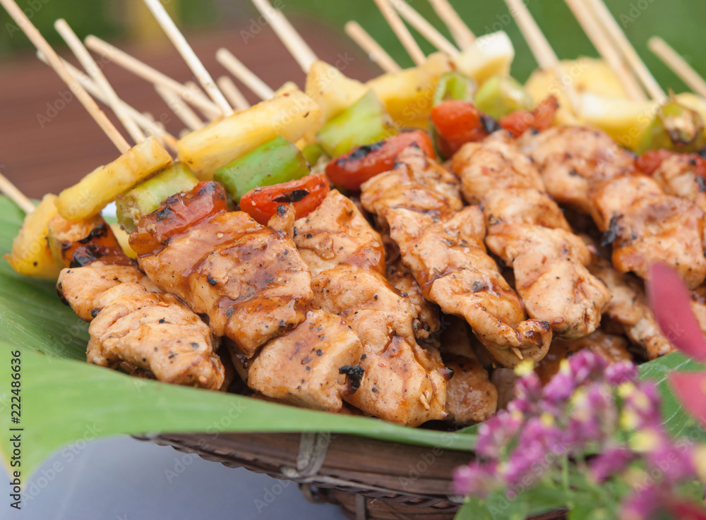 Beautifully decorated catering banquet buffet. Grilled chicken meat skewers slices with pineapple, chili and tomato. Beautifully decorated catering banquet buffet. Grilled chicken meat skewers slices with pineapple, chili and tomato.