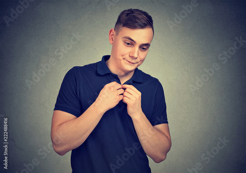 Canvas Print Shy young man looking awkward