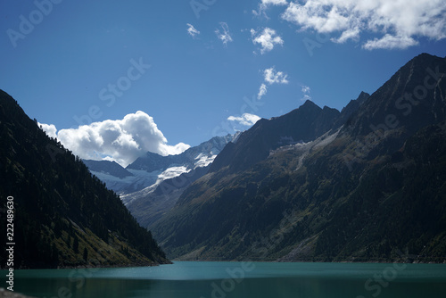 High situated reservoir in Austria with mountains in the background 