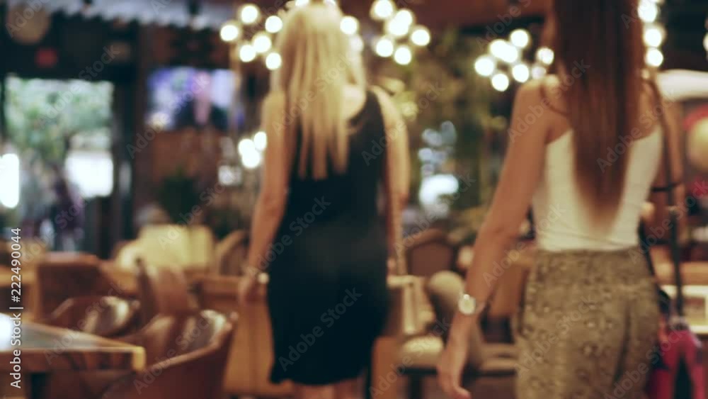 Blurred restaurant or cafe background. Tables and chairs. Visitors to the family restaurant for dinner. Beautiful bright interior. Blurred background bokeh background for design Blurred restaurant or cafe background. Tables and chairs. Visitors to the family restaurant for dinner. Beautiful bright interior. Blurred background bokeh background for design