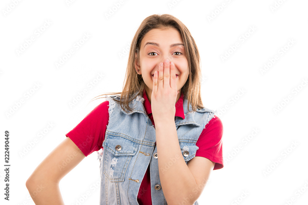 Excited young woman covering mouth Excited young woman covering mouth