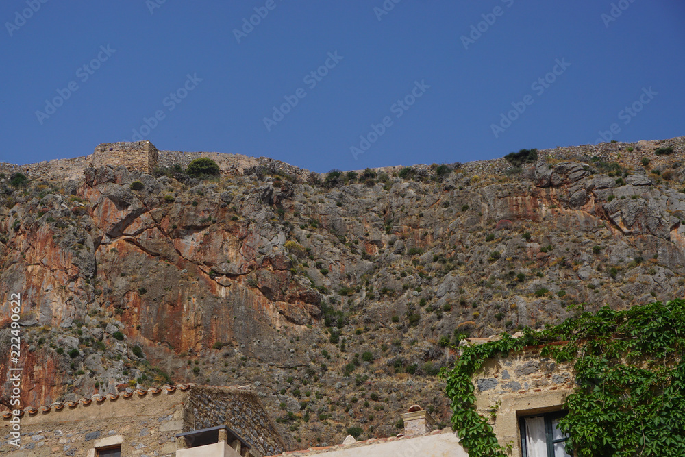 Monemvasia, Greece: View of the medieval fortress at the top of the plateau, from the town of Monemvasia (founded in 583).