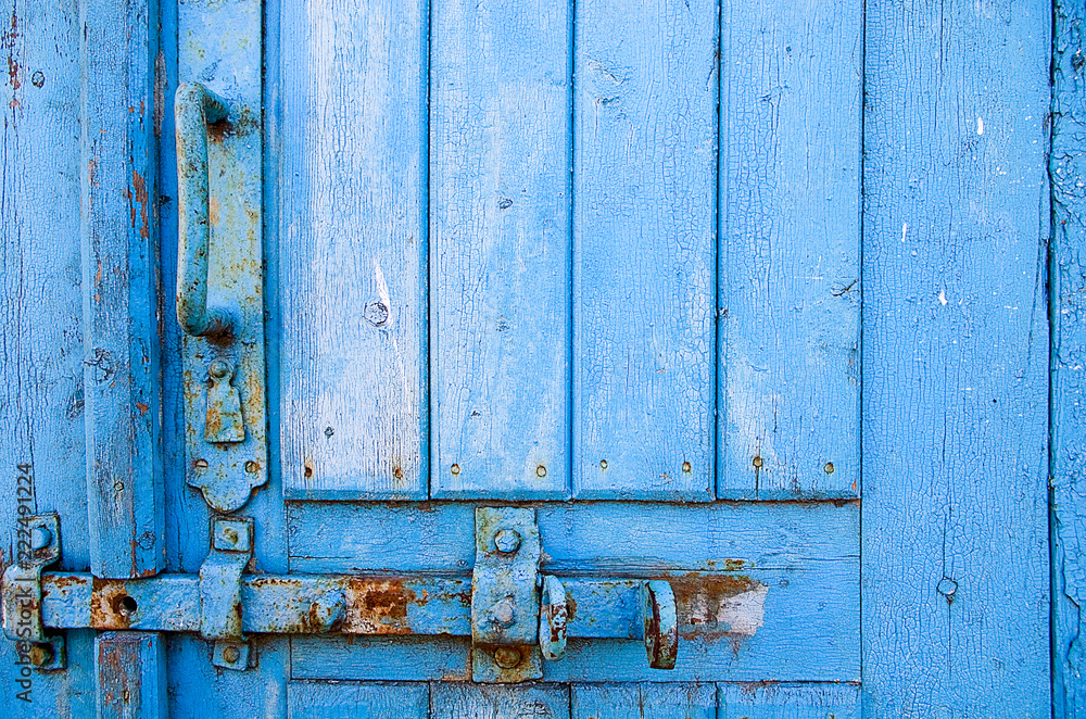 door lock for key closing, keyhole, hasp bolt. Collection of old vintage retro locks on the textured colored door. Close-up door lock for key closing, keyhole, hasp bolt. Collection of old vintage retro locks on the textured colored door. Close-up