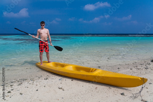 Maldives, man in canoe