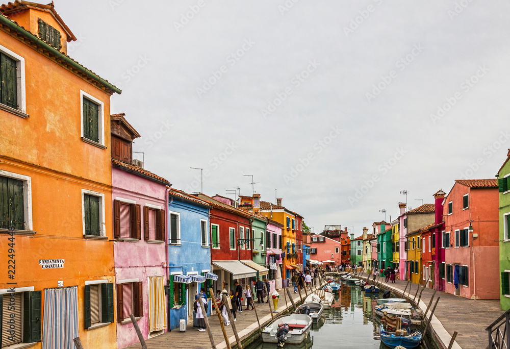 Venice, Italy: Burano island street, multicolor houses.