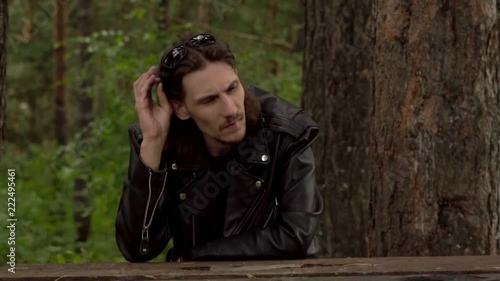 the guy in the leather jacket and glasses