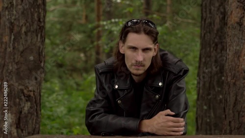 the guy in the leather jacket and glasses