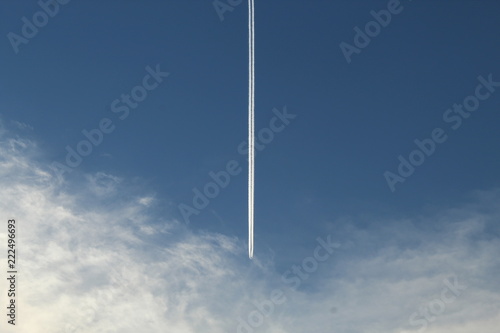 Airplane wake in a blue sky
