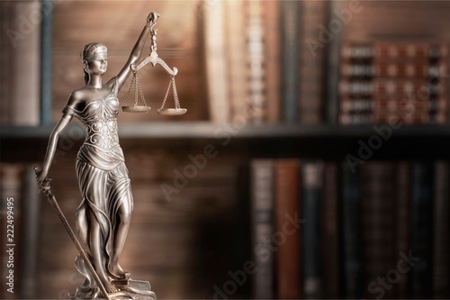 Statue of justice on library background. photo