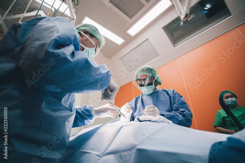 Team of Surgeons Operating in the Hospital.
