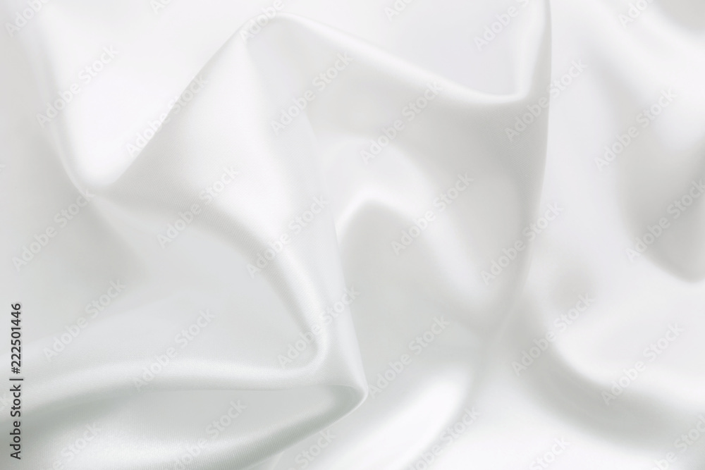 Elegant white satin silk with waves, abstract background. Elegant white satin silk with waves, abstract background.