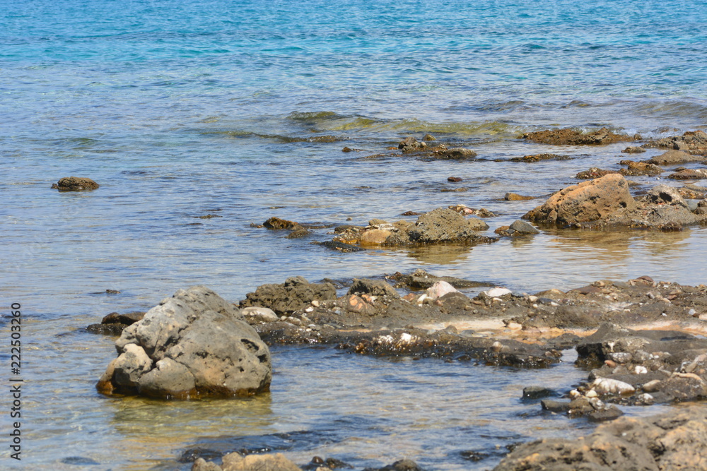 Afytos beach in Greece, rocks and blue sea Afytos beach in Greece, rocks and blue sea
