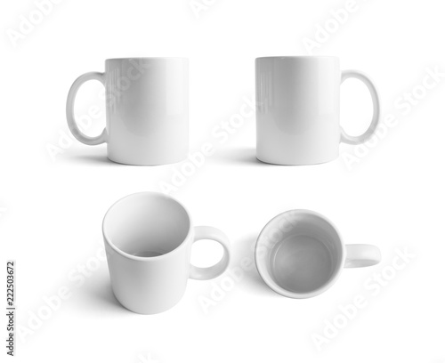 White ceramic mugs. Cups for coffee or tea isolated on white background. Responsive design mockup.