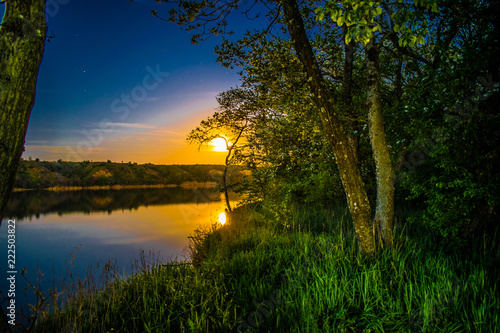 Very beautiful and colorful night and evening landscapes over the river Seversky Donets in the Rostov region. A rich moonlit sunset like a sunset, a hot hue with bright colors of nature