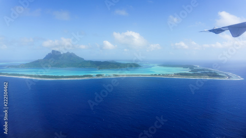 Flying Over Bora Bora's Blue Lagoon In French Polynesia photo