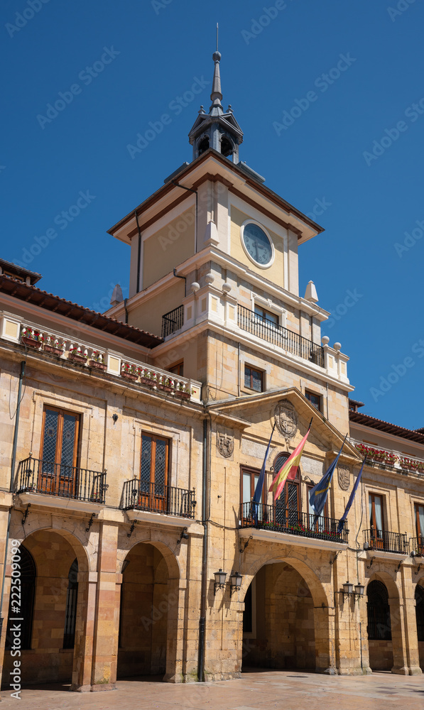 Townhall of Oviedo in early morning light with blue sky, Spain