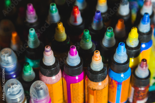 many professional bottles with colored ink for tattoos. tattoo parlor