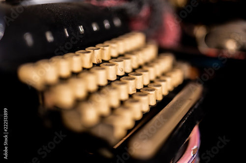 a vintage typewriter with white keys