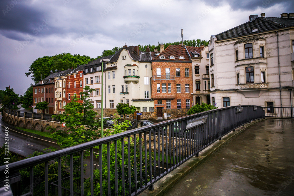 Naklejka premium old stone buildings in the rain