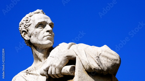 detail of a thinker and jurist statue in front of the Palazzo della Cassazione in Rome photo