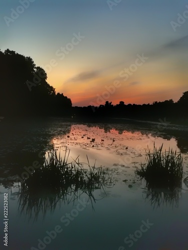 Fototapeta Naklejka Na Ścianę i Meble -  Sunset over the pond.