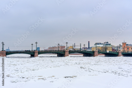 Sampsonievsky Bridge over frozen Bolshaya Nevka River. Saint Petersburg. Russia photo