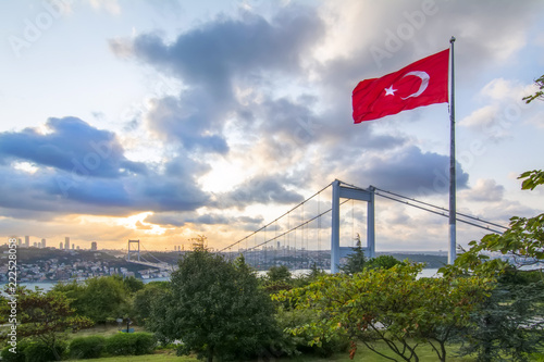 View of the Turkish Flag and the Fatih Sultan Mehmet Bridge photo, taken from Otagtepe, Beykoz in Istanbul, Turkey © blackdiamond67