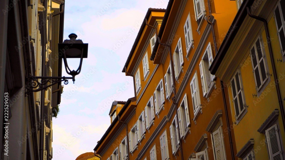 Windows and walls in the old streets in Italy. Architecture of the old European city. Trieste, Italy.