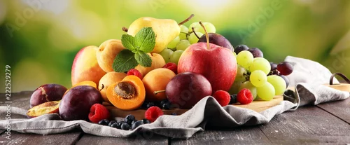 Obraz  z motywem Fresh summer fruits with apple, grapes, berries, pear and apricot