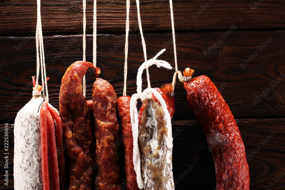 sausages hang from a rack at market. Country dark style. Traditional