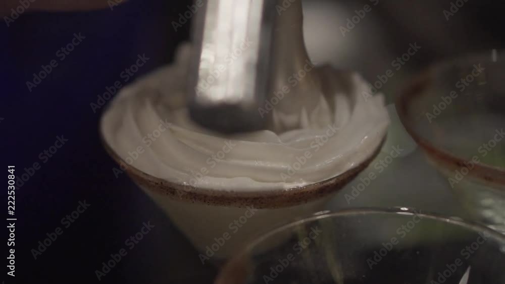 Chef adding whipped cream to delicious sweet dessert - video in slow motion Chef adding whipped cream to delicious sweet dessert - video in slow motion