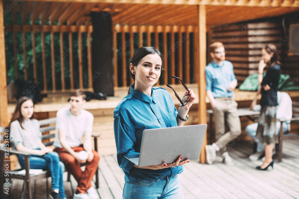 Woman with glasses and a laptop. Modern employee of the creative team. Woman with glasses and a laptop. Modern employee of the creative team.