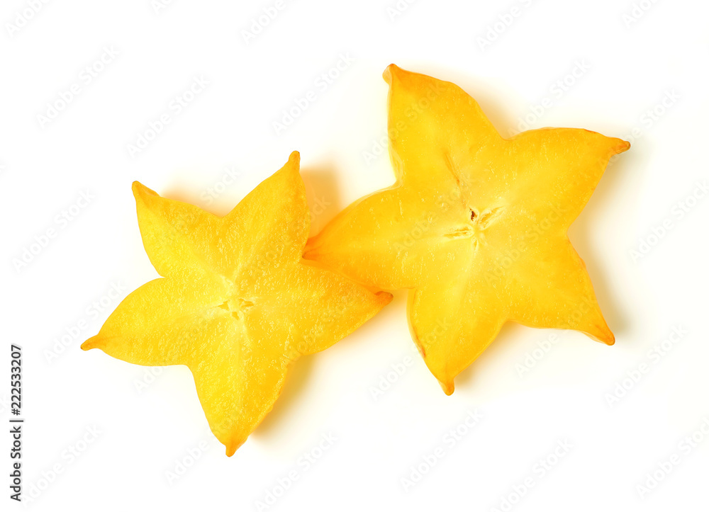 Top View of Vibrant Yellow Star Shape of Two Sliced Ripe Star Fruits on white background Top View of Vibrant Yellow Star Shape of Two Sliced Ripe Star Fruits on white background