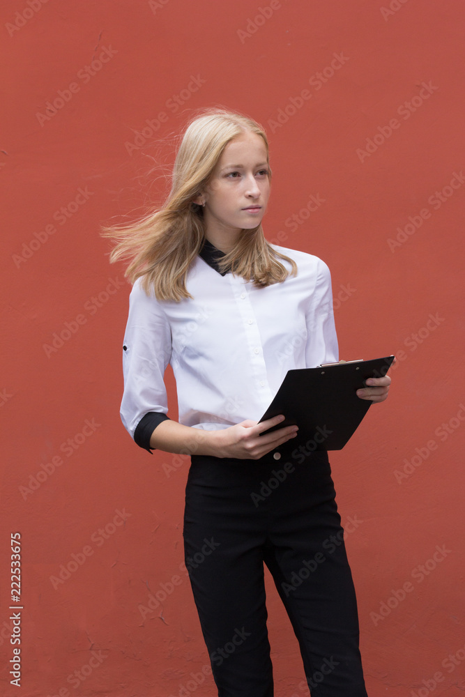 Portrait of a young smiling woman isolated on background with copy space Portrait of a young smiling woman isolated on background with copy space