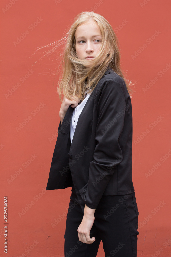 Portrait of a young smiling woman isolated on background with copy space Portrait of a young smiling woman isolated on background with copy space