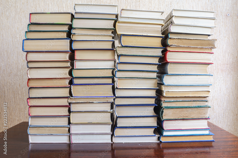 Fototapeta premium Stack of Used Old Books Background