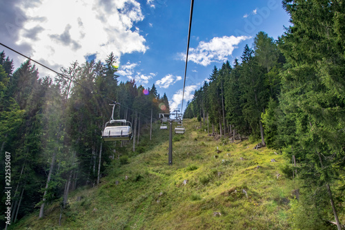 Chairlift installation through a pine-tree forest in Auronzo di Cadore italy 